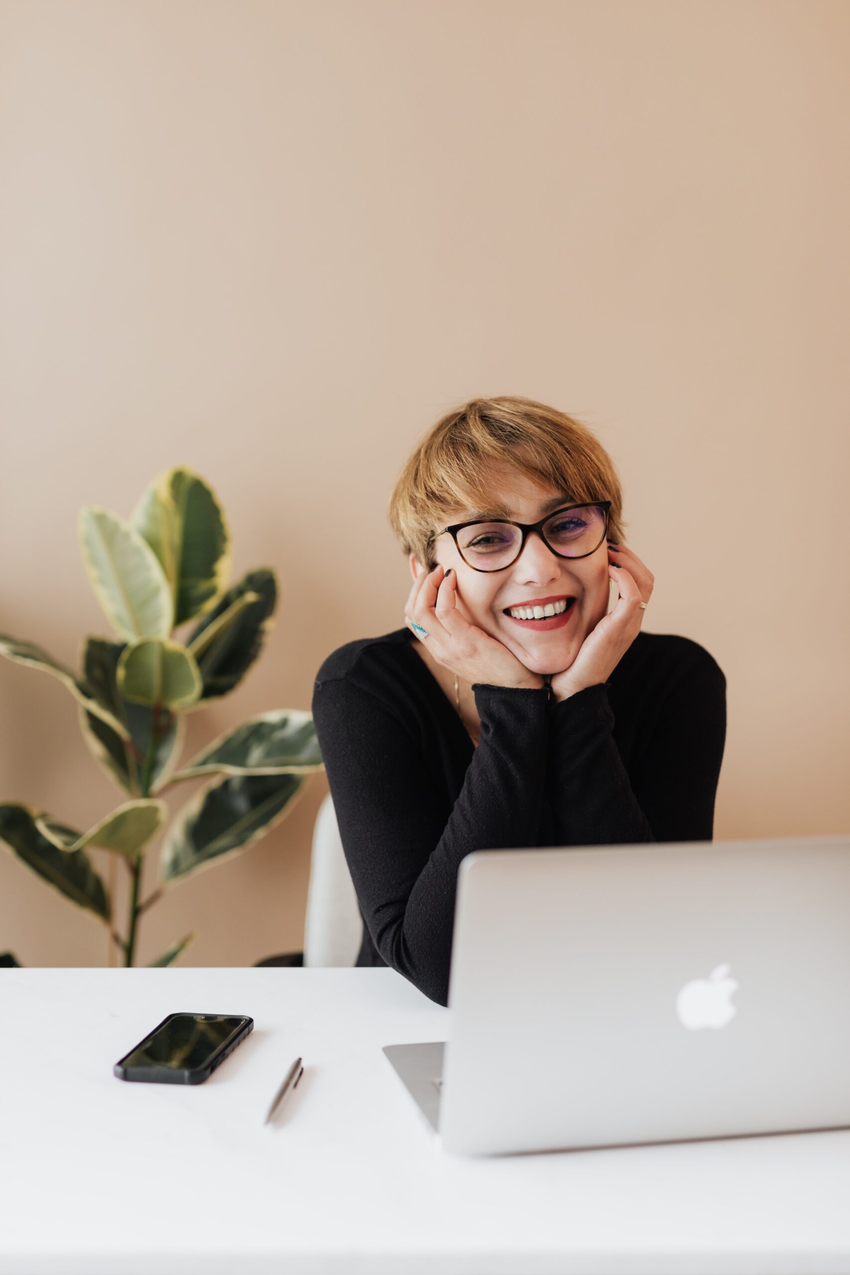 woman with glasses at computer